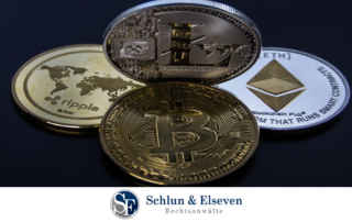 Three coins on a dark background: Bitcoin, Ethereum, Ripple